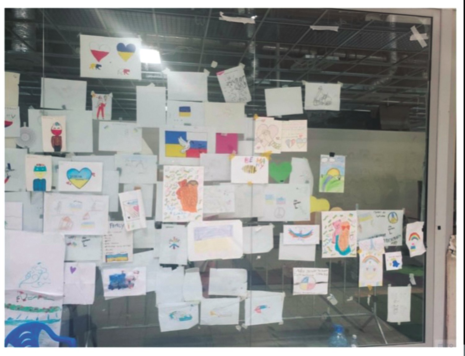 DRAWINGS IN POLAND: As part of the counseling service in Poland, children created drawings which were hung on the wall. Dane saw that many of the drawings had other country’s flags and messages of support but there were very few drawings with a reference to America. (Submitted photo)